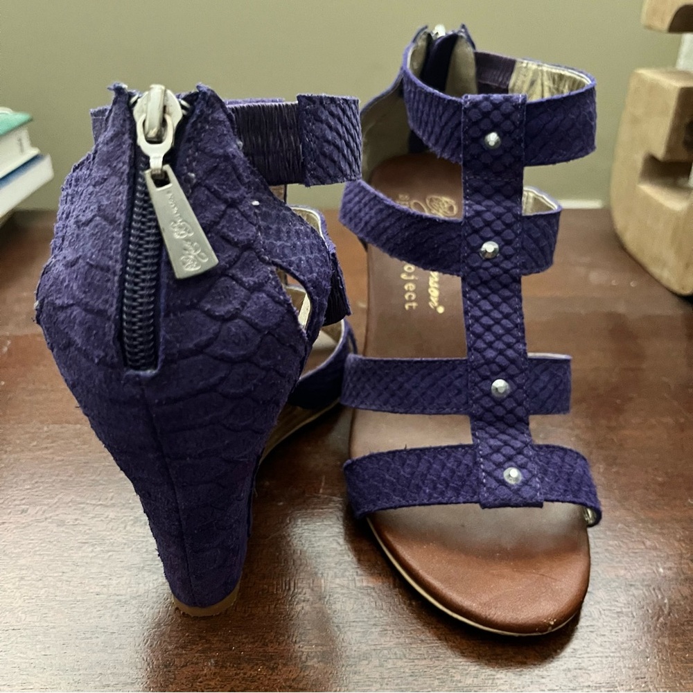 7M size. Purple strapped wedges with silver rhinestones going down the middle